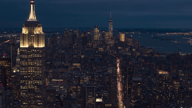 videoblocks-aerial-close-up-city-lights-and-dense-traffic-on-streets-of-new-york-at-night_rfp0cdw9x_thumbnail-full01